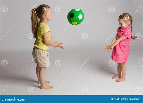 Ccheerful Kids Throwing and Catching Ball. Concept of Happiness and Game. Stock Image - Image of ...