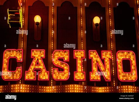 Casino sign in neon lights at night close-up. Freemont Street nightlife tourist destination in ...