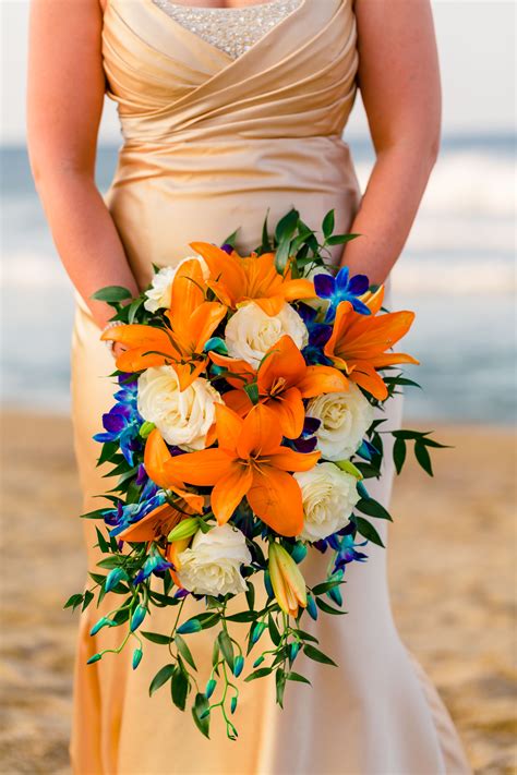 Bright and Bold Wedding Ceremony Flowers | Cascading wedding bouquets, Orange wedding flowers ...