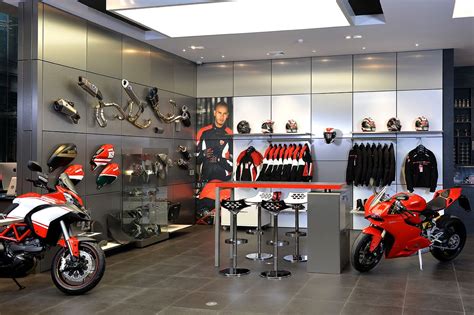 Motorcycle showroom design, Motorcycle showroom interior, Garage design ...