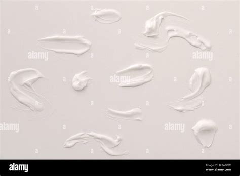 Shapes collection with body cream spots on white table. Top view. Horizontal composition Stock ...