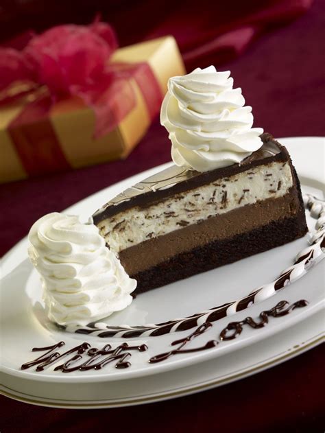 Chocolate Tuxedo Cream™ Cheesecake: Layers of moist fudge cake, chocolate cheesecake, vanilla ...