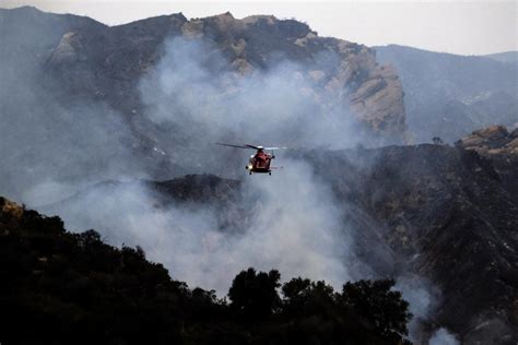 Crews make progress against LA wildfire, arson suspect ID'd