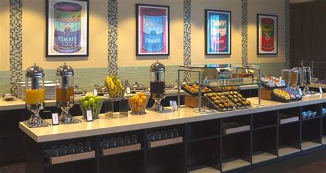 the breakfast buffet is ready to be served at the hotel or other function venue,