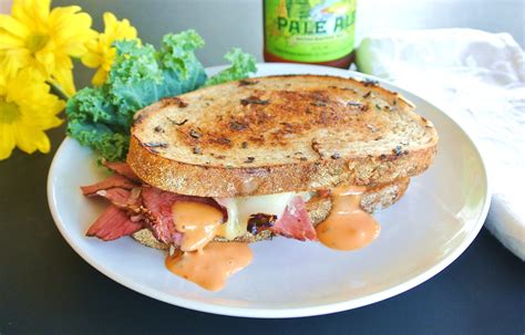 Tasty Reuben Pastrami on Rye Bread Sandwich - No Plate Like Home