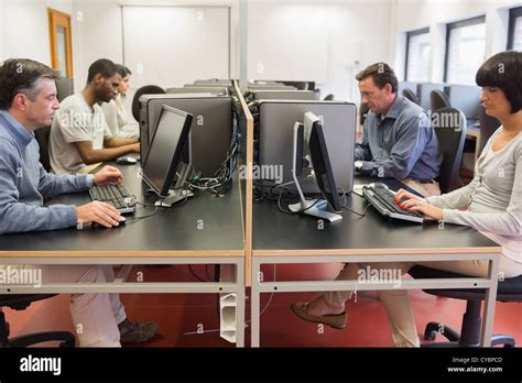 People working at computers Stock Photo - Alamy