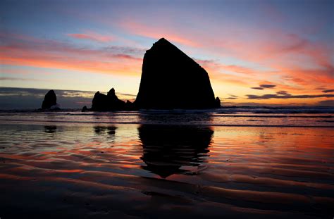 Erosion is changing the face of Haystack Rock in Cannon Beach ...