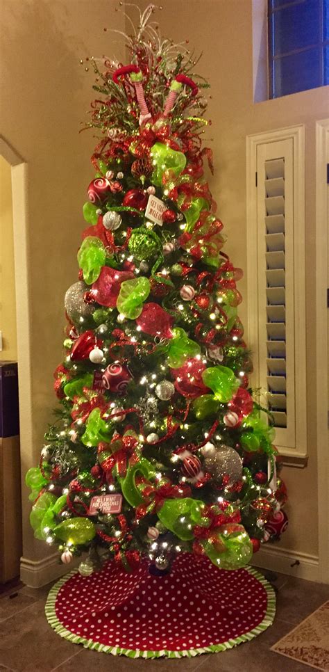 a christmas tree decorated with red, green and silver ornaments