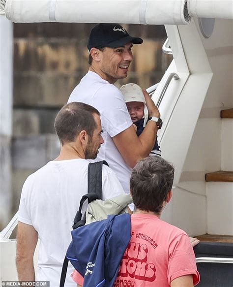 Rafael Nadal cradles his baby boy as he and wife Xisca take in a Sydney ...