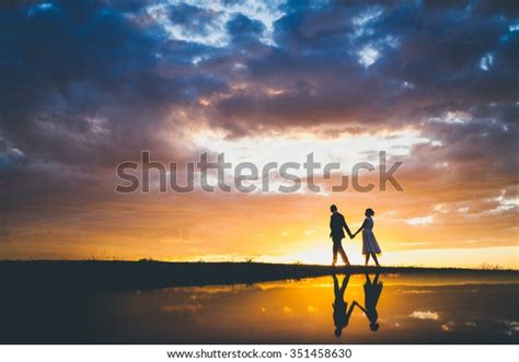 Couple Walking Sunset Stock Photo (Edit Now) 351458630