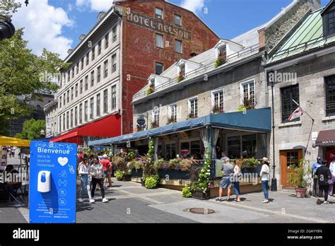 Montreal, Canada - July 31, 2021: People enjoy Place Jacques-Cartier a square with many ...