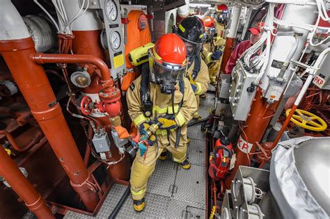 Sailors participate in a main space fire drill aboard USS … | Flickr