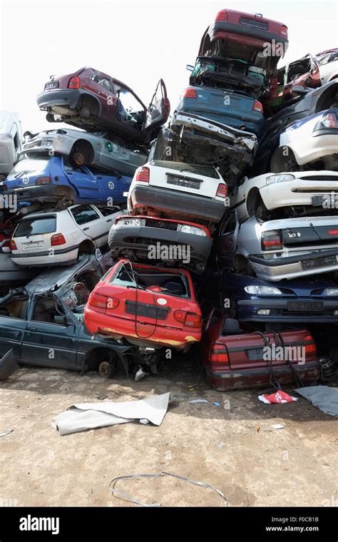 Cars stacked in scrap yard Stock Photo - Alamy