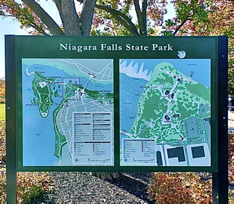 the niagara falls state park map is posted in front of a tree and grass area