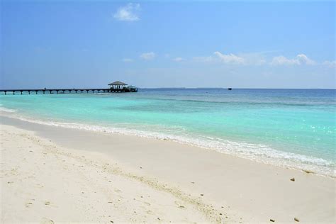 Island in the Maldives with clear blue water Photograph by Oana Unciuleanu - Fine Art America