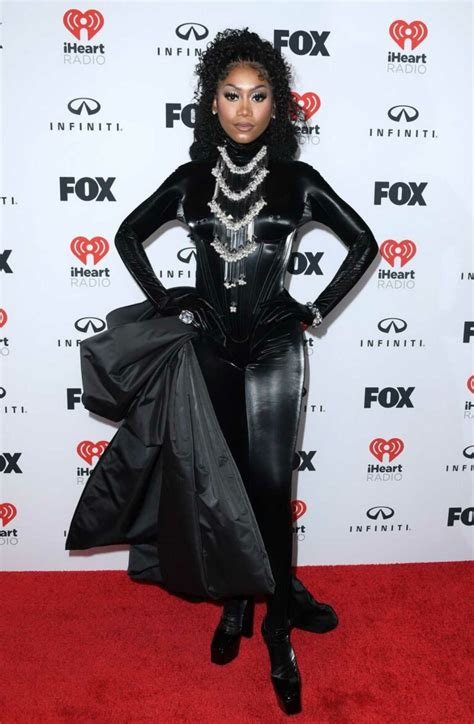 Muni Long Attends 2023 iHeartRadio Music Awards at Dolby Theatre in Los Angeles 03/27/2023-1 ...