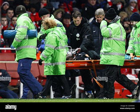 Wigan Athletic's Victor Moses is stretchered off after suffering an ...