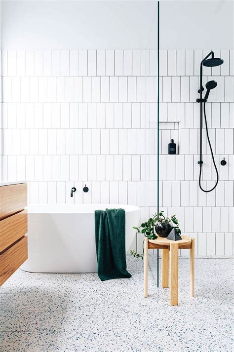 Smart, functional and stylish, this renovated bathroom with terrazzo floor tiles has it… | White ...