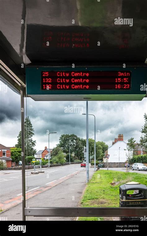 Cardiff, Wales, UK - Bus timetable showing the next buses at a bus stop ...