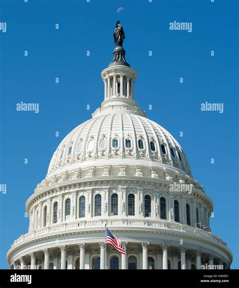 The United States Capitol building dome topped by the Statue of Freedom ...