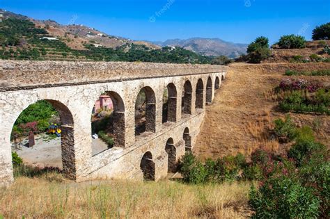 Premium Photo | Side view of the historic roman aqueduct in the city ...