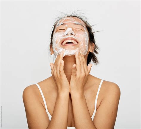 "Asian Woman Washing Face - Facial Cleanse - Natural Korean Skincare Isolated Over White" by ...