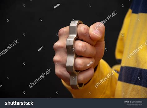 Male Hand Squeezes Metal Brass Knuckles Stock Photo 2061618860 ...