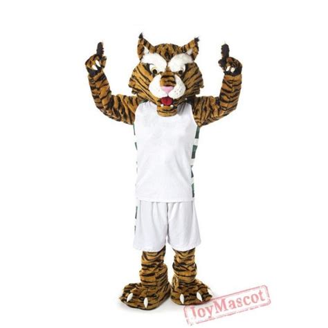 a person in a tiger costume standing with his arms up and one hand raised to the side