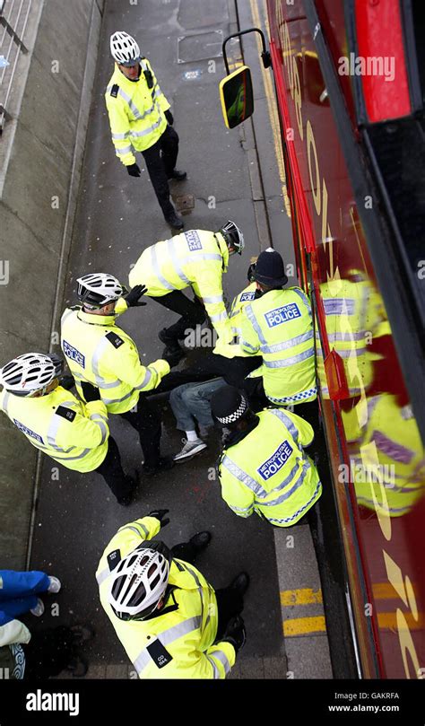 Beijing Olympics Torch Relay - London. Police wrestle a demonstrator to the ground during the ...