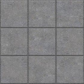 a gray tile wall with squares and lines