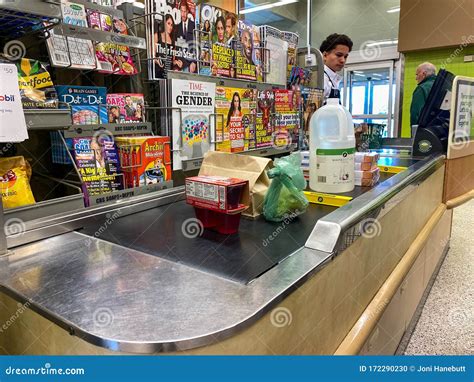 A Checkout Counter with Food on the Counter of Publix Grocery Store Editorial Image - Image of ...