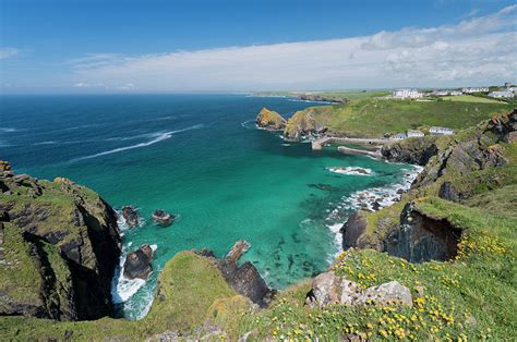 Mullion Cove And Bay In Cornwall Uk by Deejpilot