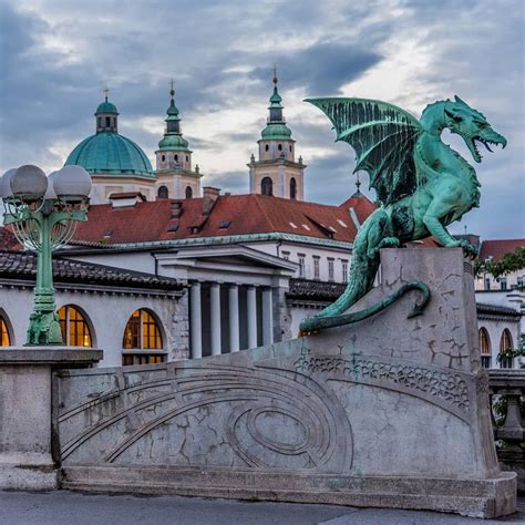 Four large dragons guard Ljubljana's Dragon Bridge in the capital of Slovenia. With two at each ...