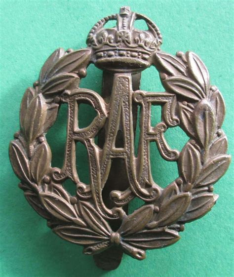 A RARE LATE WWI ROYAL AIR FORCE CAP BADGE WHICH HAS A SLIDER FITTED TO in Other RAF Badges