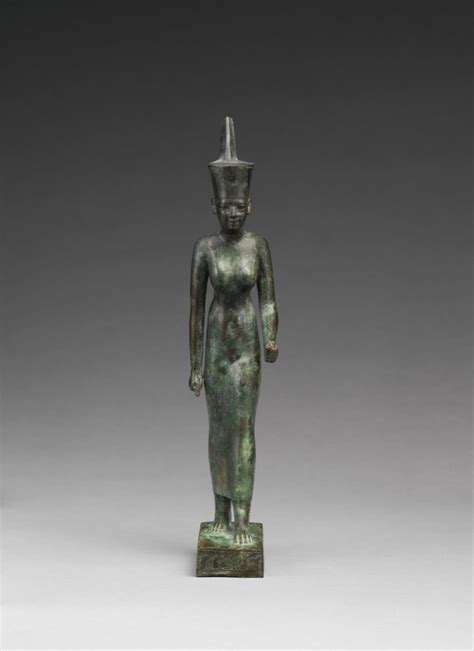 Statuette of the goddess Neith - Public domain museum image. A statue of a woman with a hat on ...