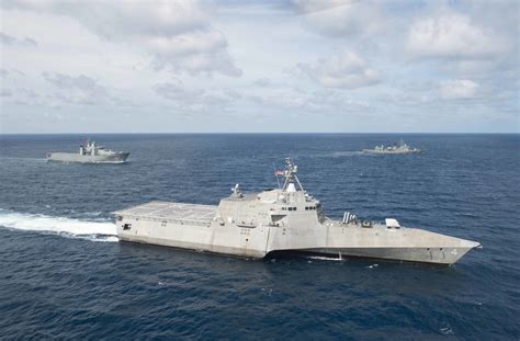 The littoral combat ship USS Coronado (LCS 4) is underway in formation with ships from the Royal ...