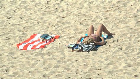 Woman Sunbathing On Bondi Beach - Hd. Stock Footage - YouTube