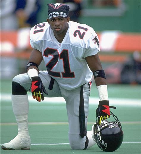 Falcons rookie Deion Sanders takes a knee before a... - SI Photo Blog