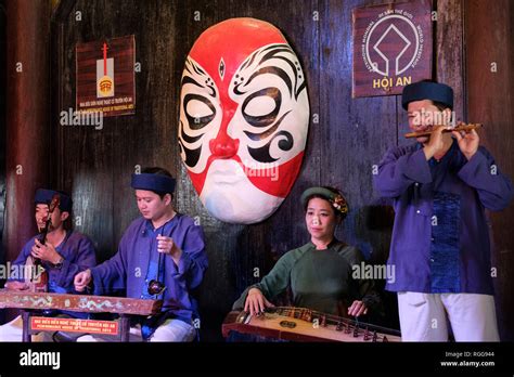 Musicians playing vietnamese music with traditional musical instruments in Hoi An, Vietnam Stock ...