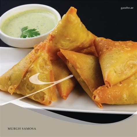 Triangular, flaky pyramid shaped pastry stuffed with chicken mince, fresh coriander, onions and ...