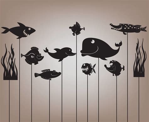 shadow puppets with various sea animals on a shadow display background ...