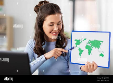 teacher with world map having online class at home Stock Photo - Alamy