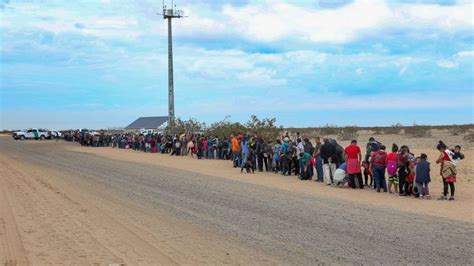 Largest single group of migrants ever tunnels under border wall in ...