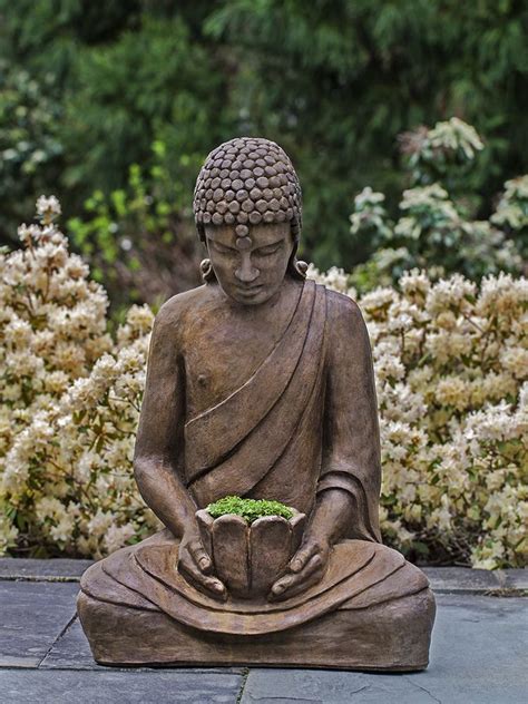 Buddha, deep in meditation, focuses on the lotus flower in his hands. | Stone garden statues ...