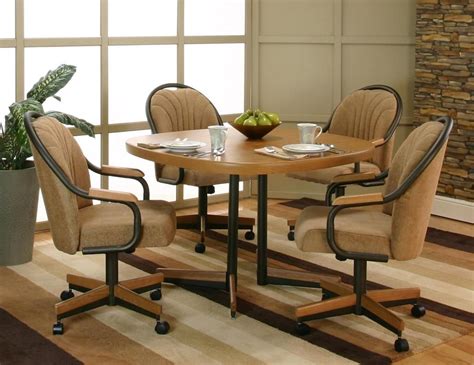 beige armed chairs round metal table for small kitchen stone wall design | Dining room chairs ...