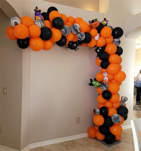 Orange and black halloween balloon arch organic with foils | YTEevents