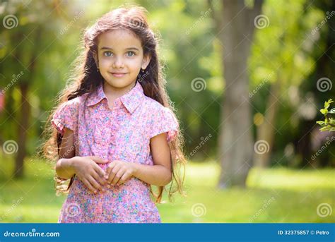 Portrait of Hispanic Girl in Sunny Park Stock Image - Image of adorable ...