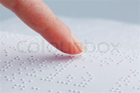 Fingers and Braille. Blind people read ... | Stock image | Colourbox