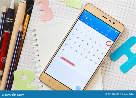 Calendar on a Smartphone with a Marked Date First September and School ...