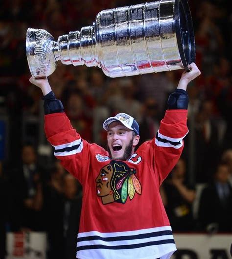 Chicago Blackhawks center Jonathan Toews lifts the Stanley Cup Monday after defeating the Tampa ...